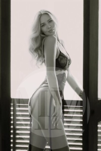 Dubai escort Elena stood on a balcony