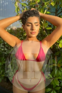 Madrid escort India wearing a pink bikini