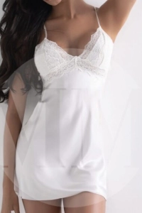 London escort Khloe wearing a white night gown